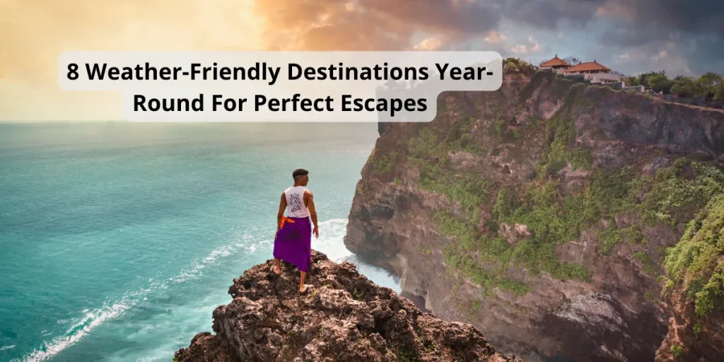 Traveler on a cliff overlooking turquoise ocean and dramatic coastline, representing weather-friendly destinations year-round for perfect escapes.