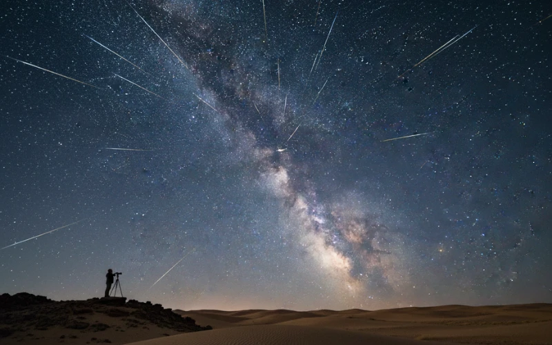Bright meteors streaking across a clear desert sky during the 2025 Perseid and Geminid meteor showers.