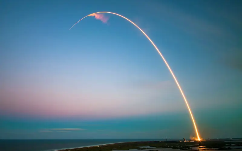A powerful rocket launches toward space during sunrise, symbolizing humanity’s ongoing search for life on Mars and interplanetary exploration.