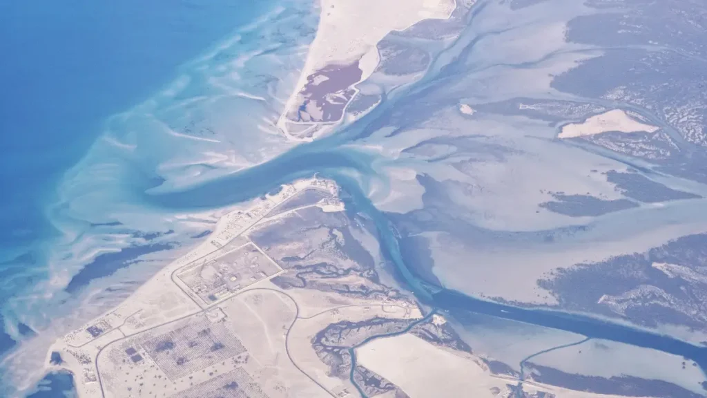Aerial view of the Gulf of Suez showing branching coastal channels, sediment patterns, and land formations revealing ongoing tectonic and geological activity in the region.”