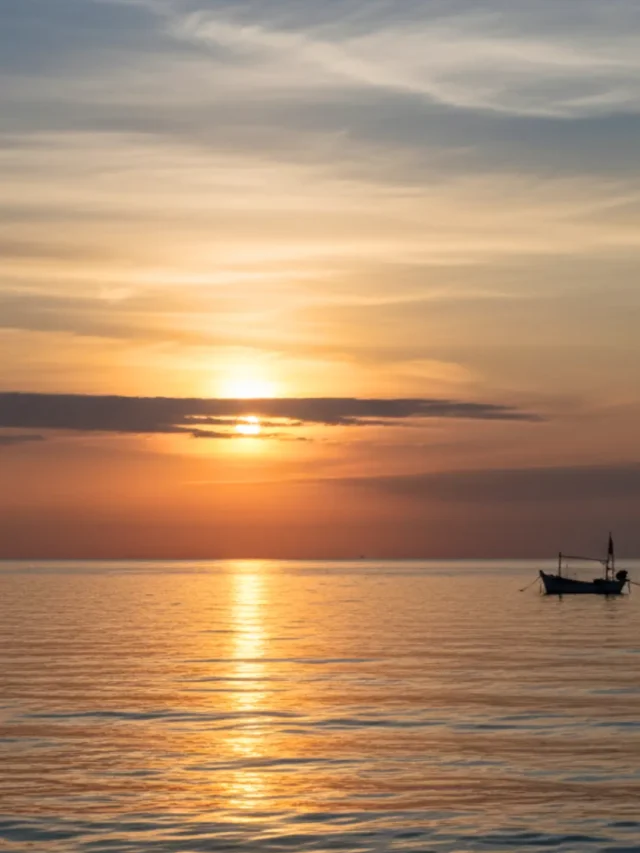 Dimming clouds over ocean during a warm sunset