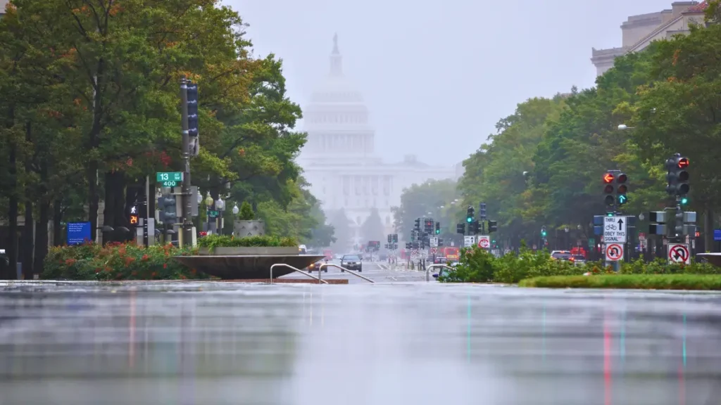 Rain-soaked streets in Washington as rising water and low visibility highlight the severe flood risk predicted for the region next week.